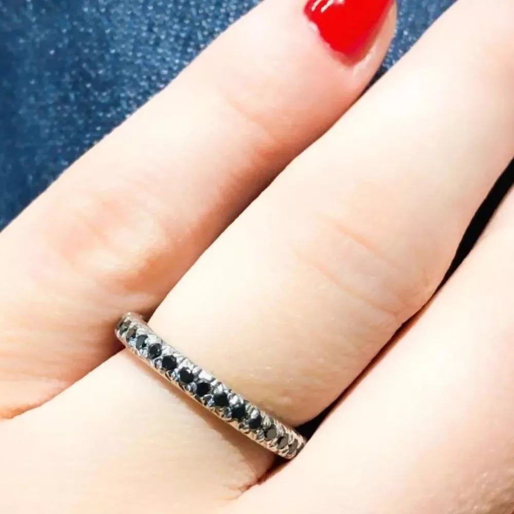 Eternity ring in platinum set with brilliant-cut Fancy Black diamonds.