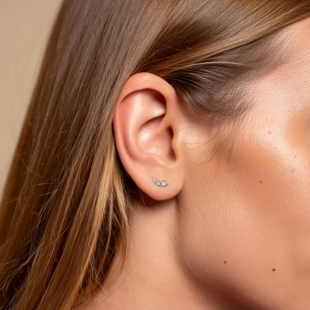 Aros en oro rosa con diamantes talla brillante.