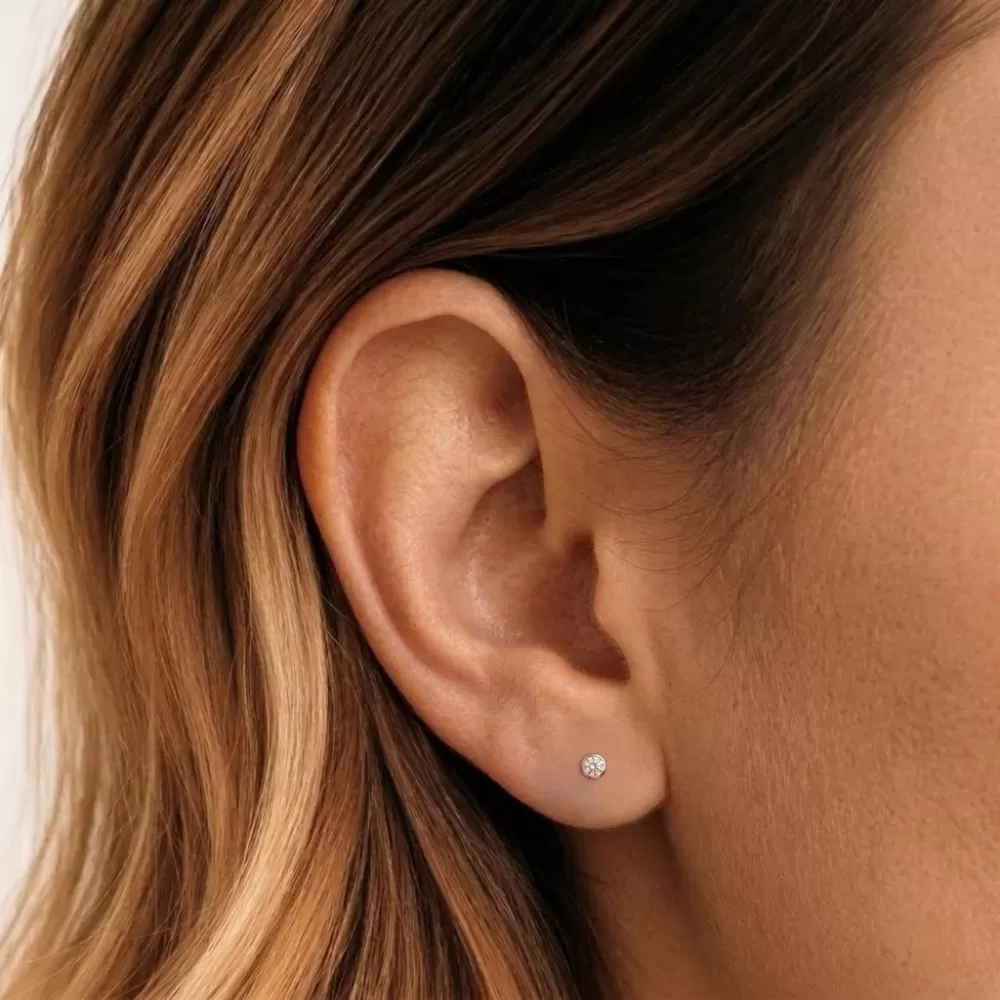 Aros en oro rosa con diamantes talla brillante.