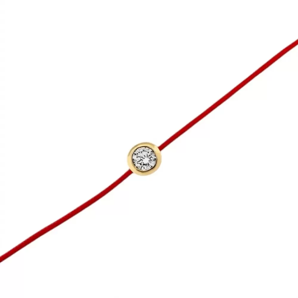 Pulsera de hilo rojo en oro amarillo con diamante talla brillante.