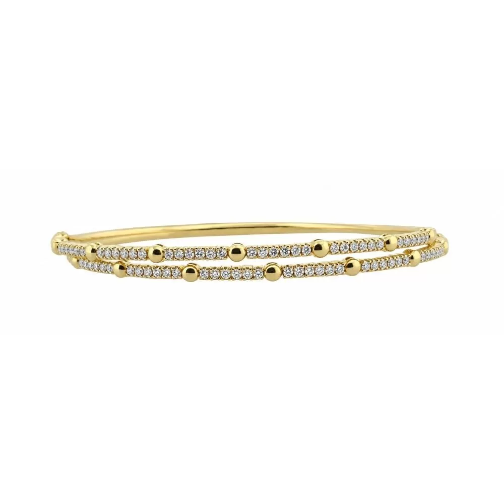 Pulsera en oro amarillo con diamantes talla brillante.